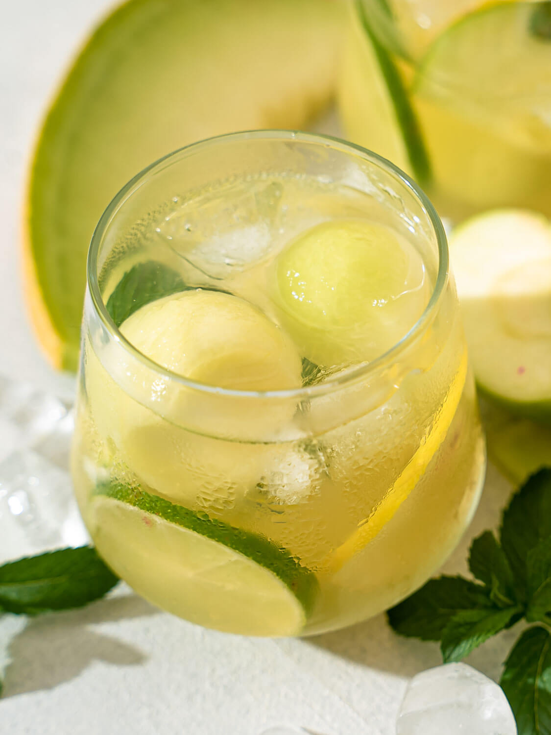 A closeup of a glass of Melon and Apple Sangria