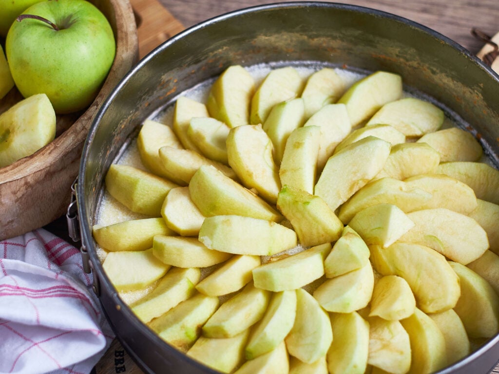 layered apples on a springform pan