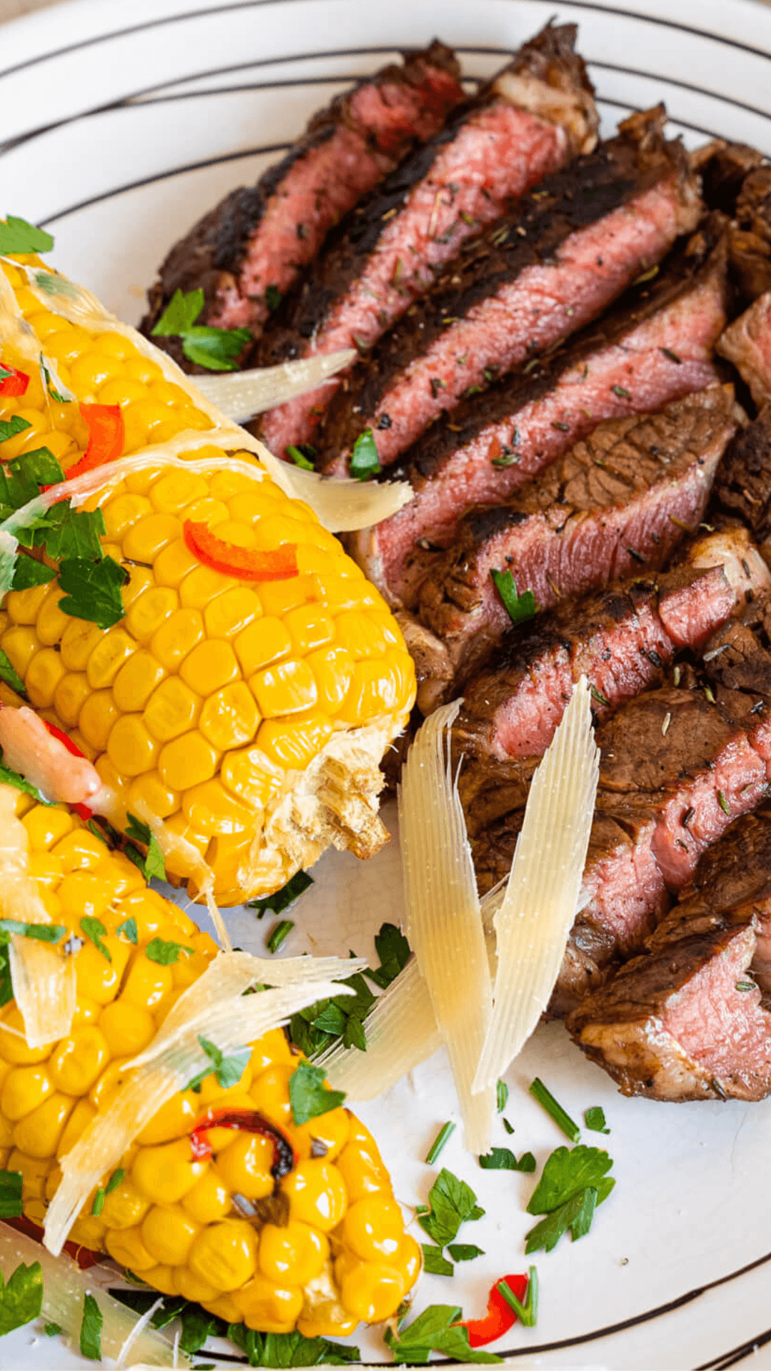 grilled corn and grilled balsamic steak on a plate