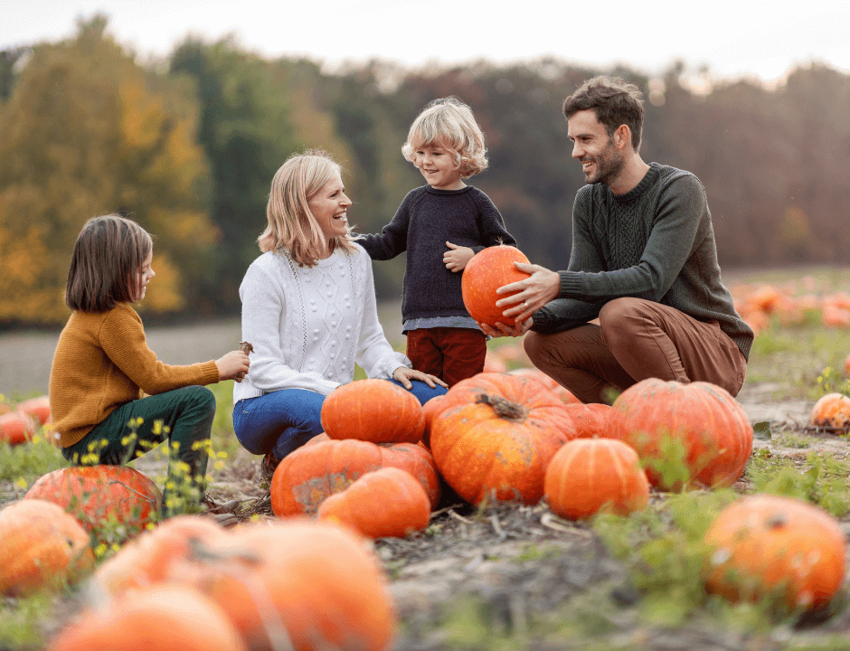 A family enjoying their time at a pumpkin patch - Find Local Pumpkin Patches