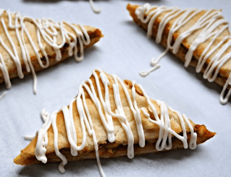 Three pieces of glazed Pumpkin Cream Cheese Turnover