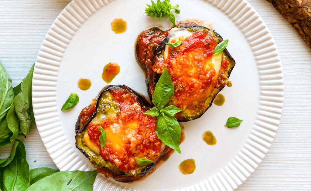 Two pieces of Eggplant Pesto Parmesan