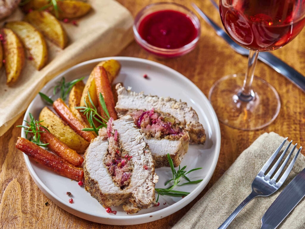 Easy Apple and Walnut Stuffed Pork Tenderloin served on a plate