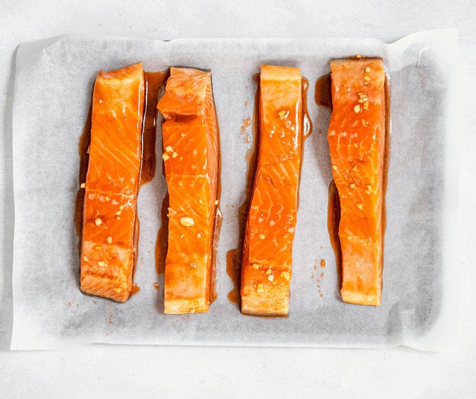Salmon fillets on a baking sheet