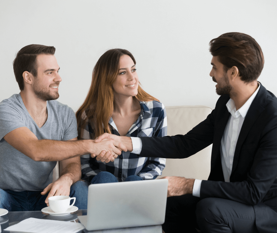 A couple meeting with a real estate agent