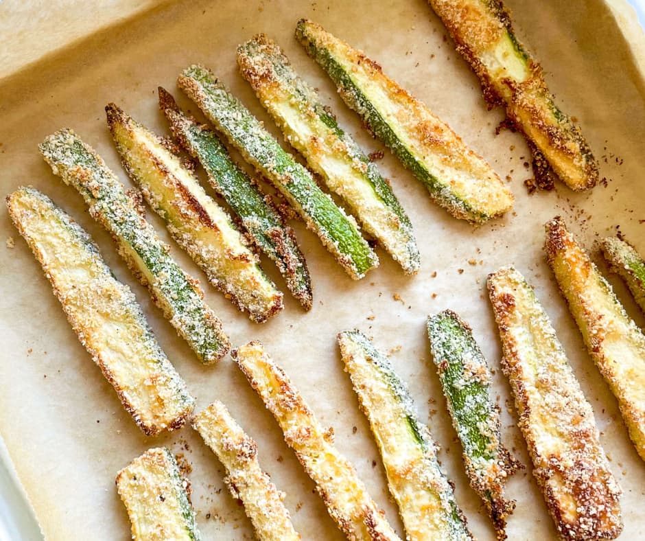 A tray of golden brown baked Zucchini Fries