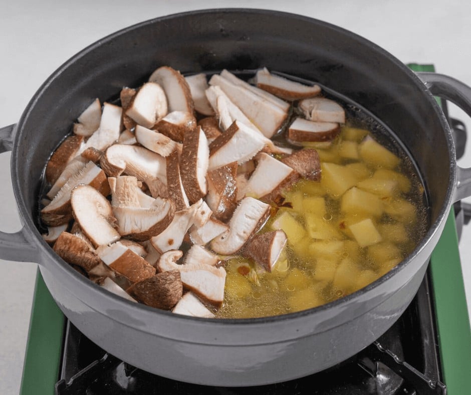 Boiling mushrooms and potatoes