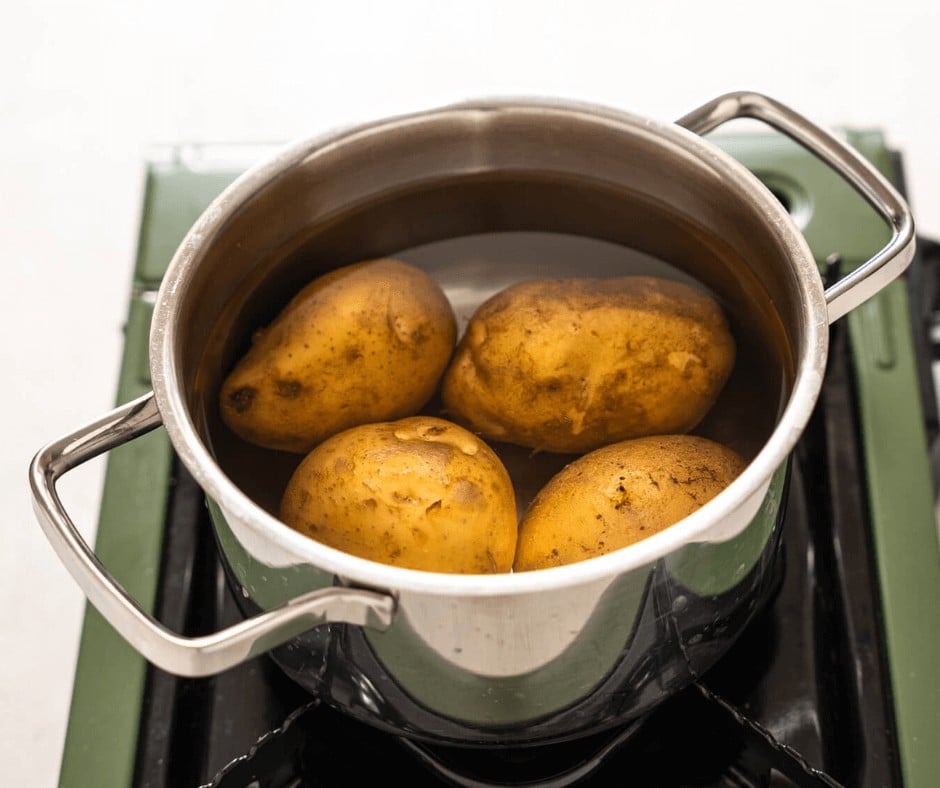 Boiling the potatoes before mashing them