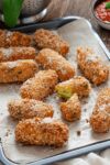 Freshly cooked Cheesy Potato Croquettes on a baking sheet