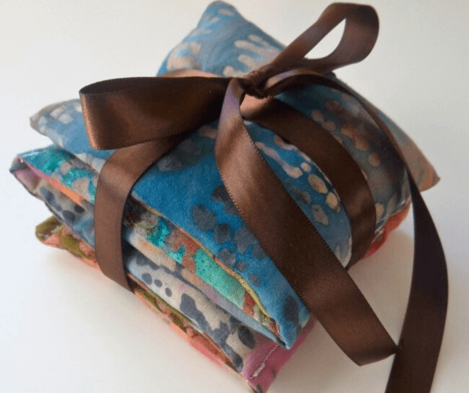 Homemade Heating Pad with flaxseeds tied together by a brown ribbon