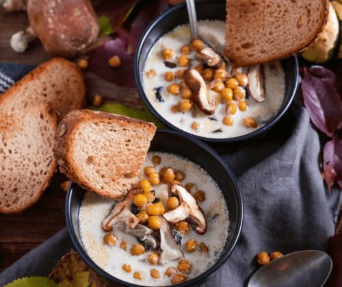 Two bowls of Best and Creamy Winter Soup with toasted bread