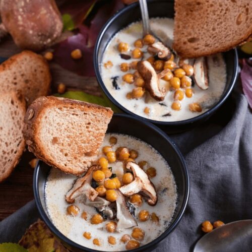 Two bowls of Best and Creamy Winter Soup with toasted bread