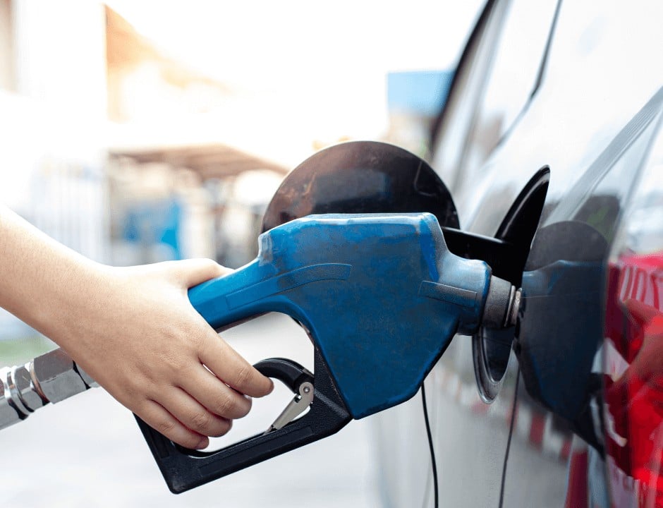 A person pumping gas - Tips To Save Money on Gas