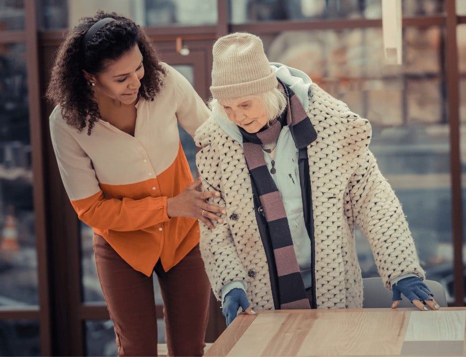 A woman helping out an old lady -25 Small Ways to Pay It Forward