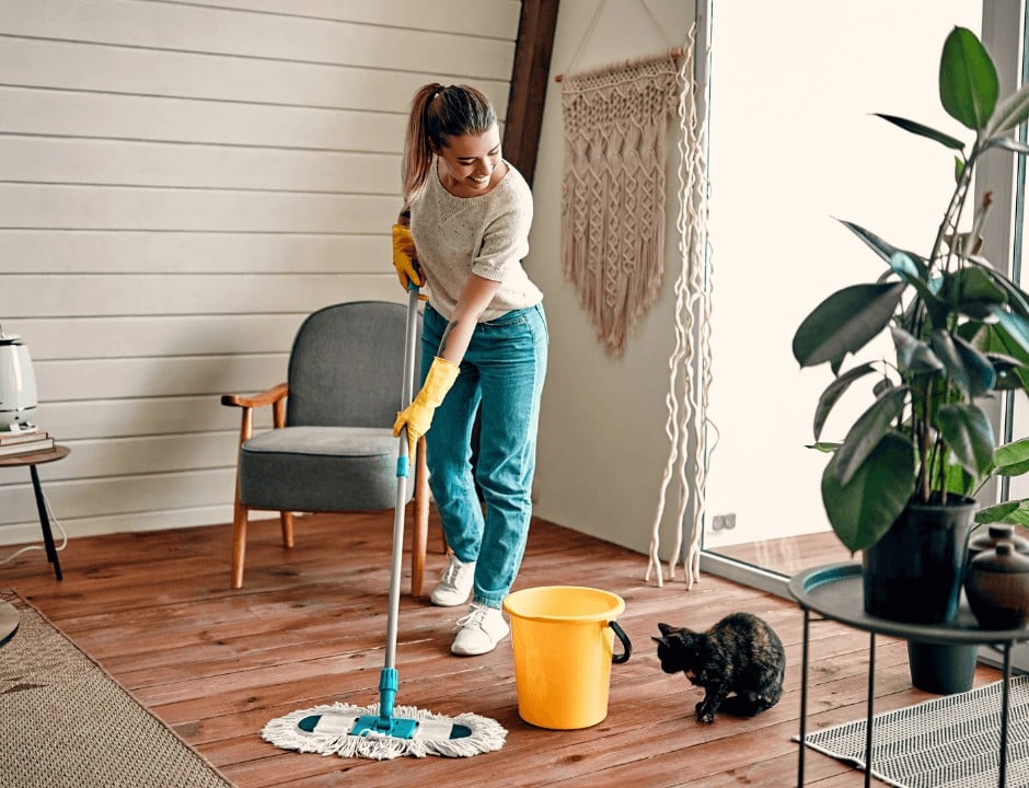 A woman mopping her floor