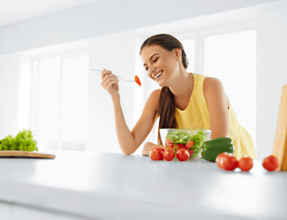 A woman enjoying her salad