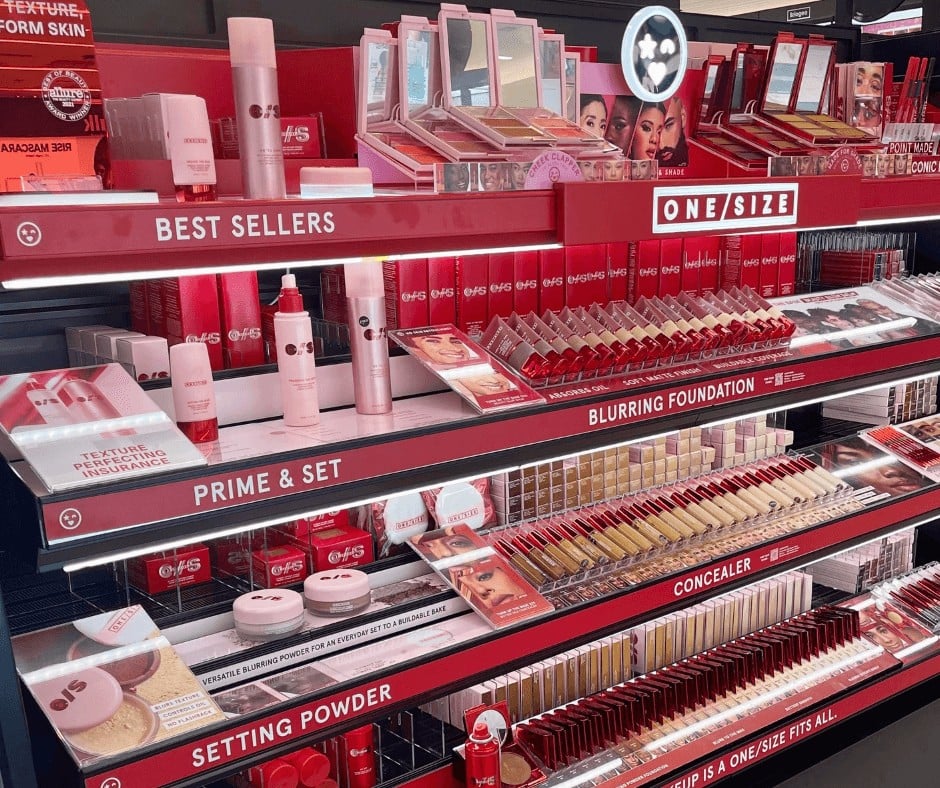 Makeup products in pink- themed rack - Makeup Return Policies