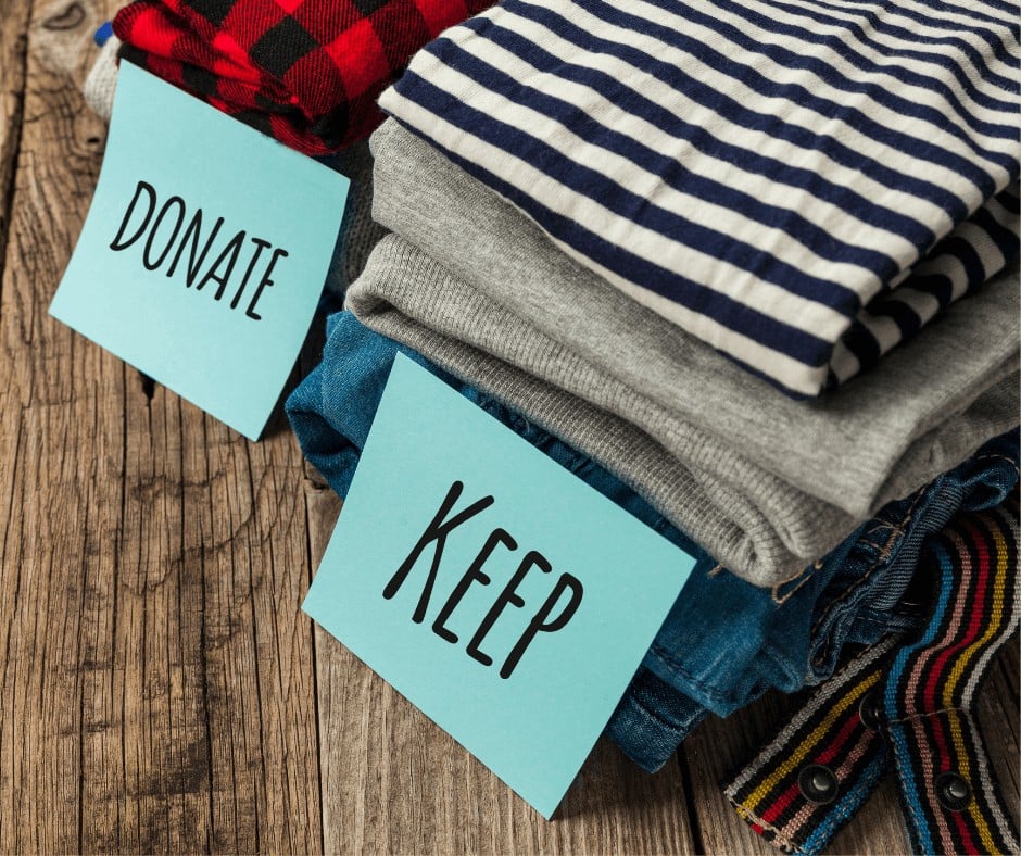 Pile of clothes marked donate and keep