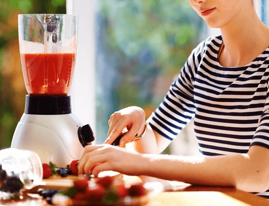 Woman making a smoothie