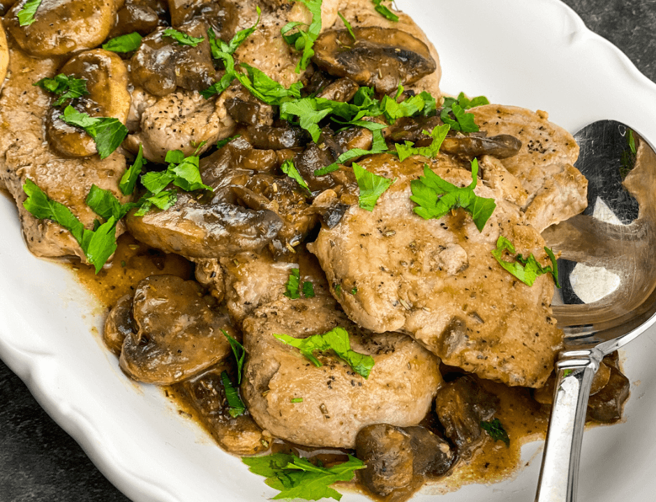 A closeup of Pork Scallopini with Mushrooms and Gravy