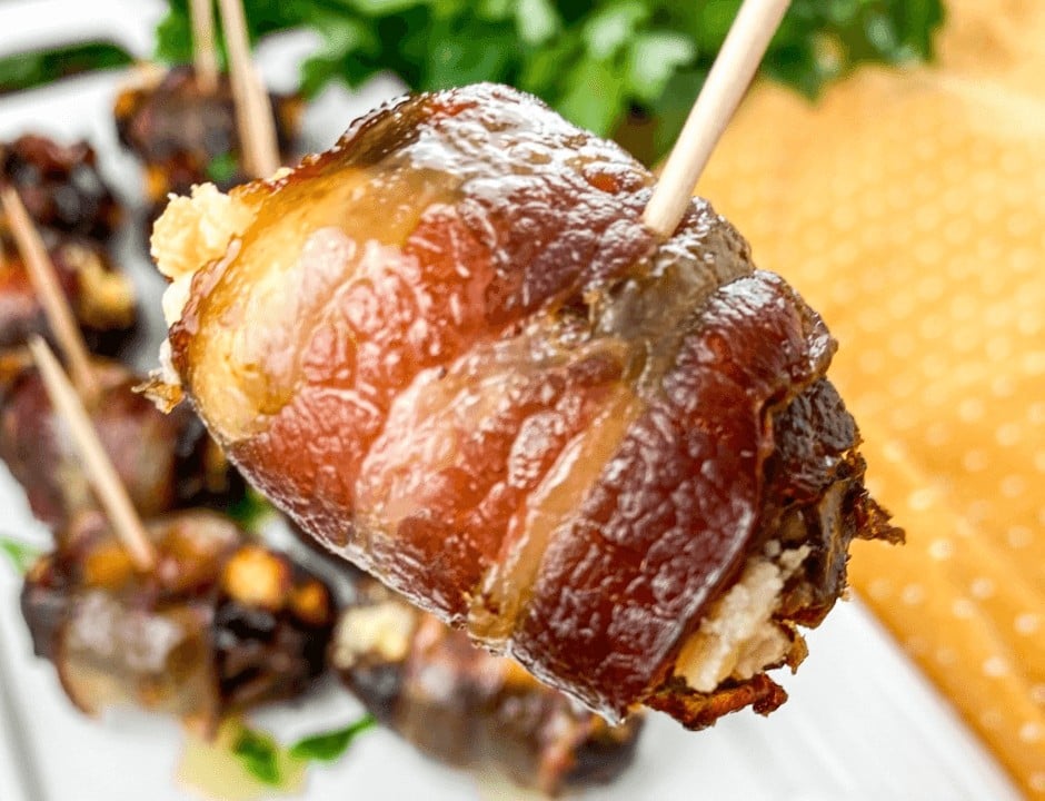 A closeup of a Bacon-Wrapped Stuffed Date