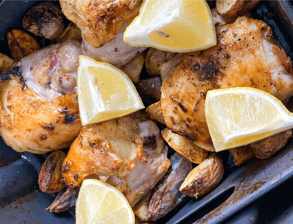 Lemon slices on top of the air fried chicken and potatoes