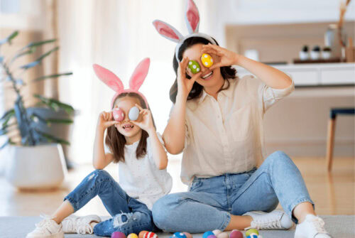 A mother and child wearing bunny ears for Easter