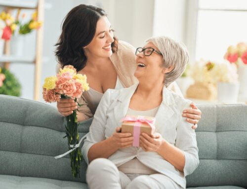 A woman surprising her mother with flowers