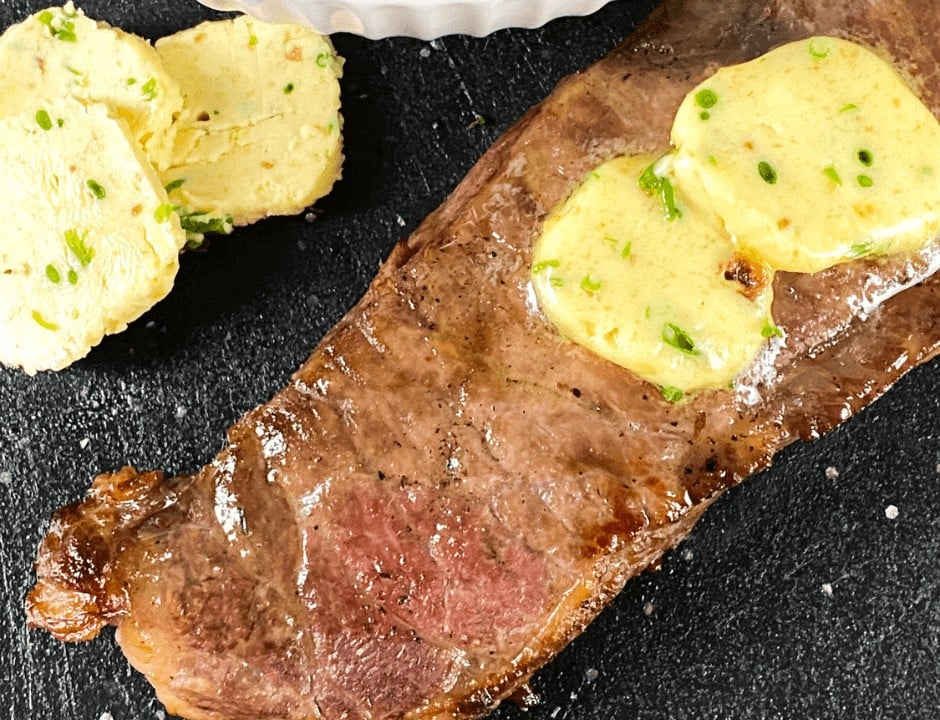 Air Fryer Steak with slices of Garlic Butter on top