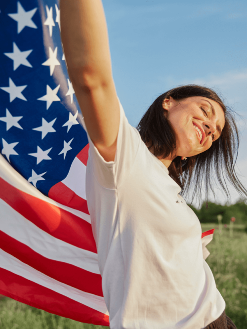 A woman holding an American flag