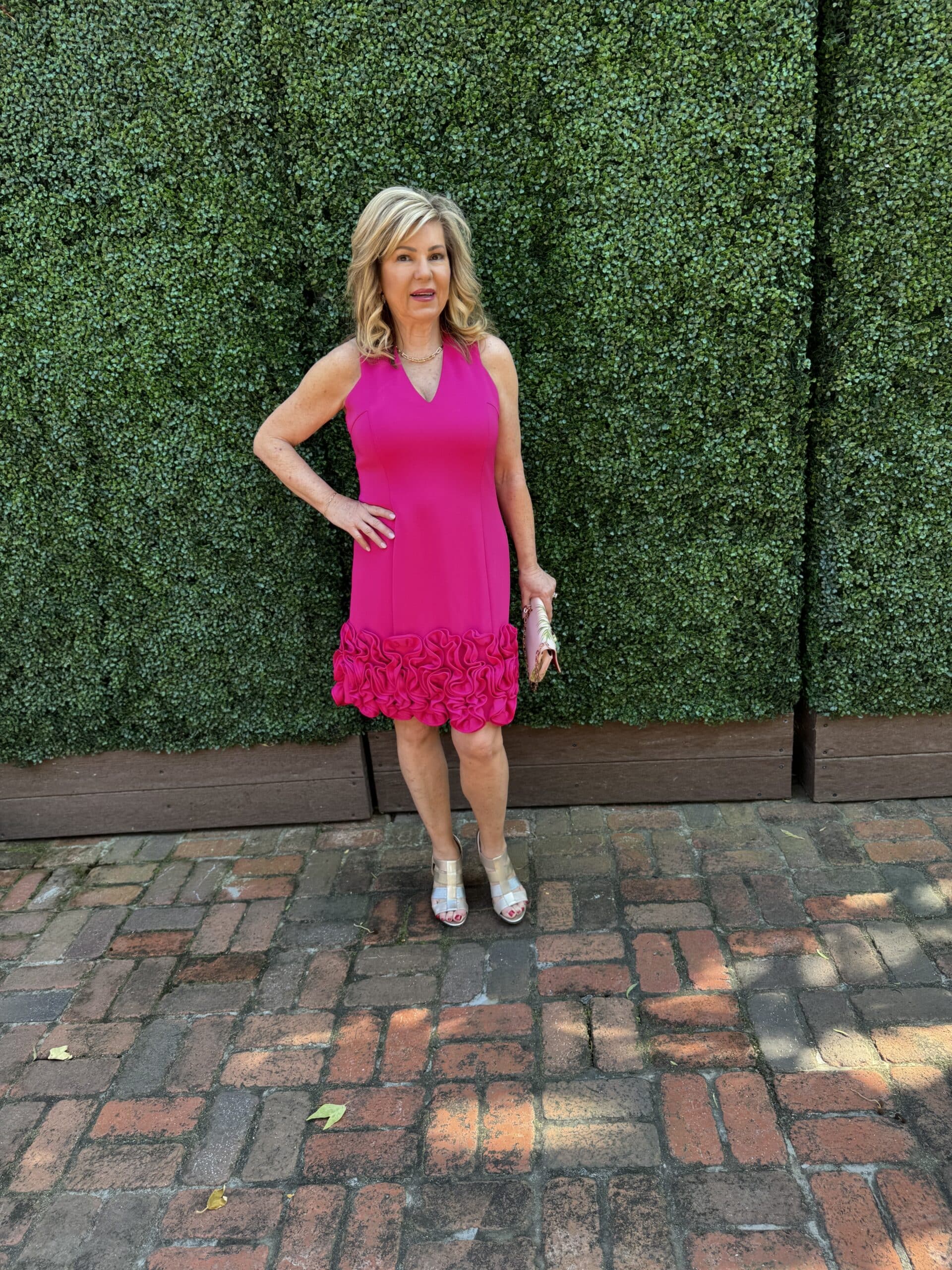 Lori Felix in a hot pink short dress from Curated Brands