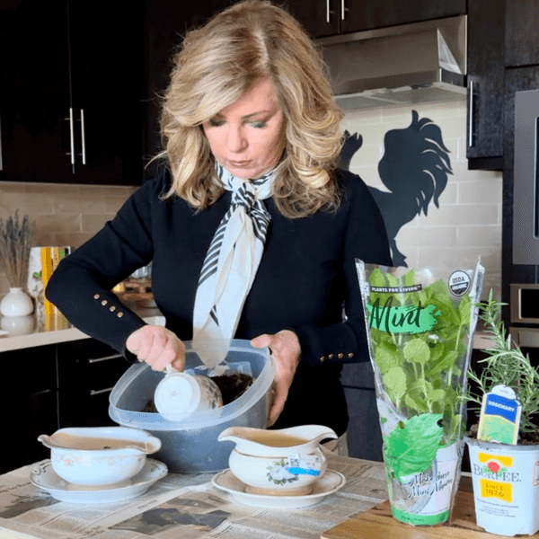 Lori scooping planting mix for her DIY Herb Garden