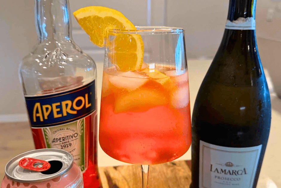 A closeup of a cold glass of Aperol Spritz