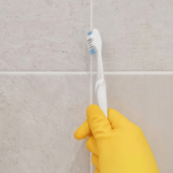 Cleaning grout and tiles using baking soda