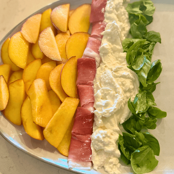 Layering the Peach and Tomato Caprese Appetizer