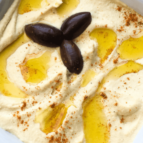 A closeup of Creamy Roasted Garlic Hummus