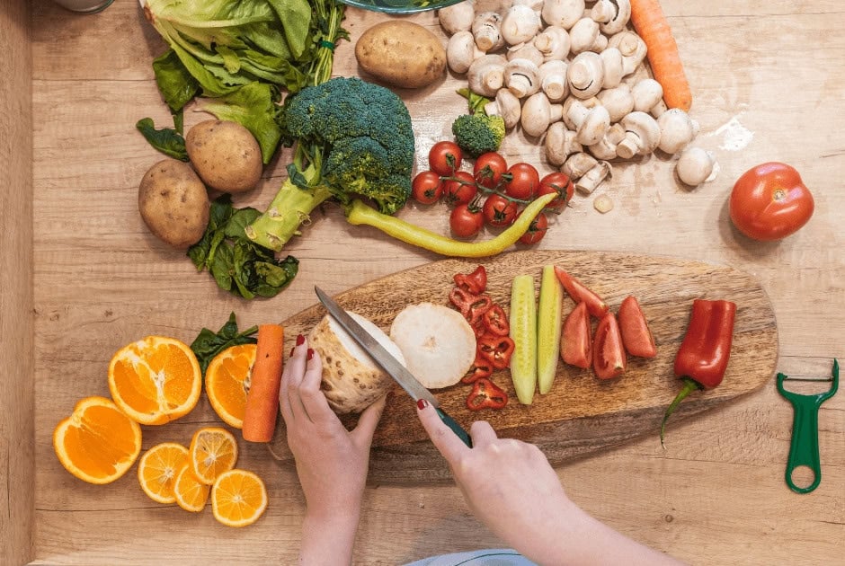 A person cutting vegetables