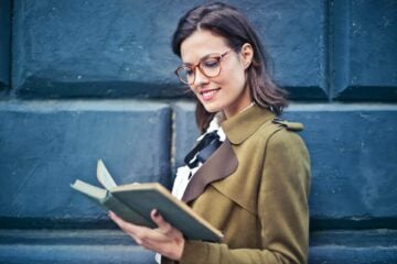 Woman In Brown Suede Peacoat Reading A Book - 10 Unique Gifts for Book Lovers