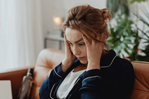 A stressed woman - 10 Tips to Reduce Stress During the Holiday Season