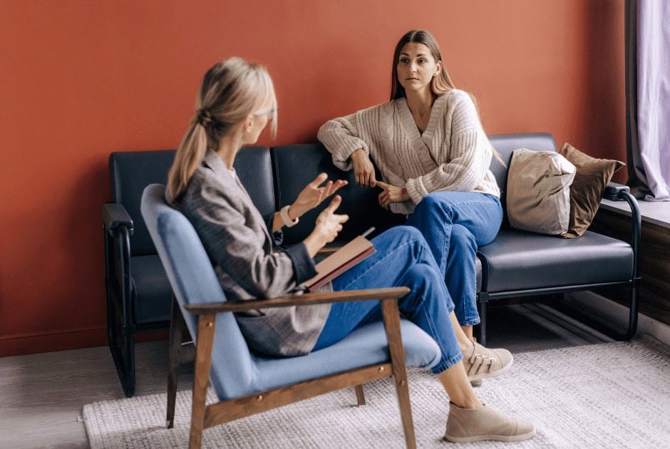 A woman speaking to her therapist - 10 Tips to Reduce Stress During the Holiday Season