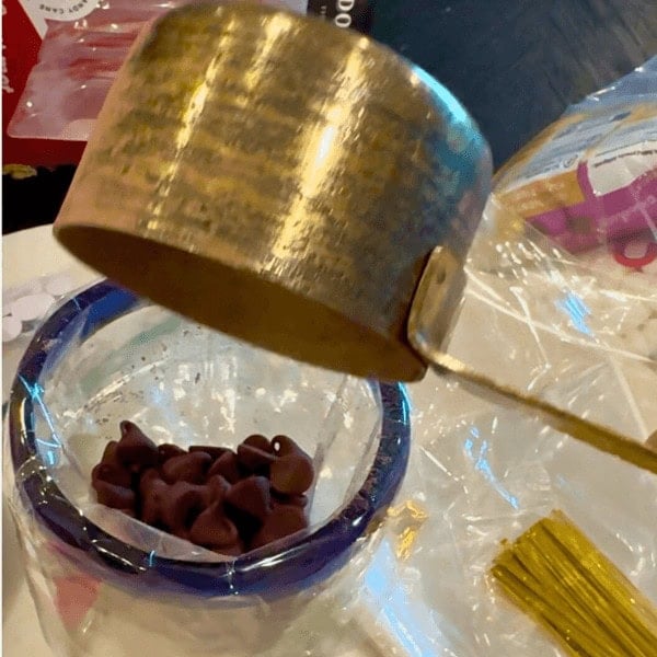 Placing the chocolate chips in the cello bag