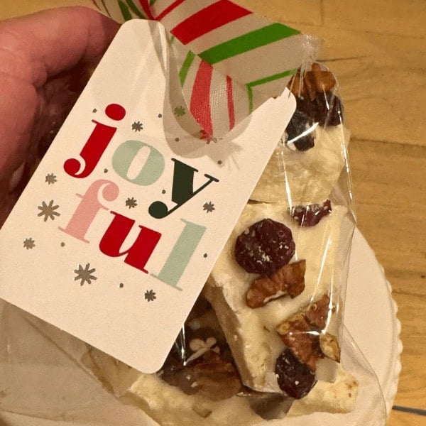 White Chocolate Christmas Bark in a snack bag for the holidays with a Christmas tag