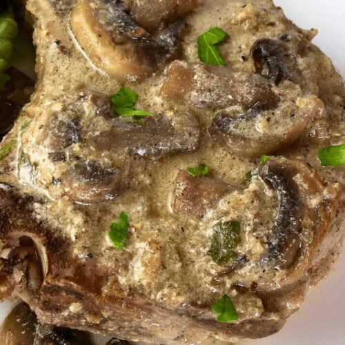 A closeup of Pork Chops with Creamy Mushroom Sauce