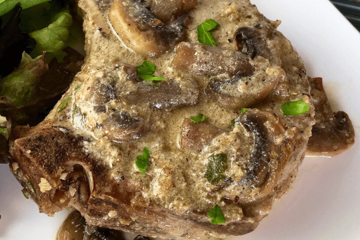 A closeup of Pork Chops with Creamy Mushroom Sauce
