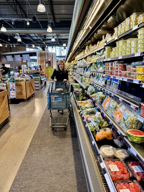 Lori Felix pushing grocery card in grocery store