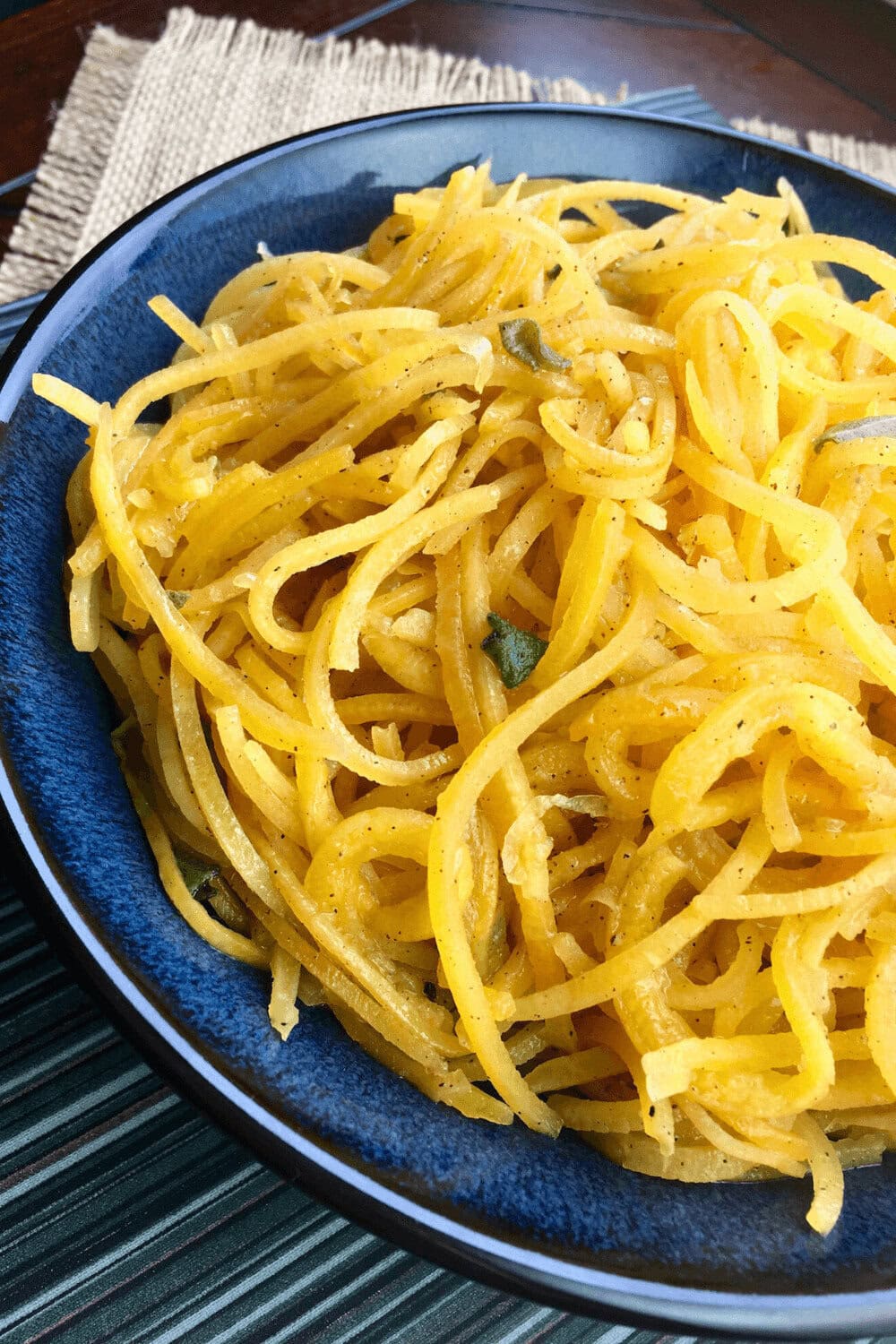 A serving of Savory Butternut Squash Noodles on a blue plate