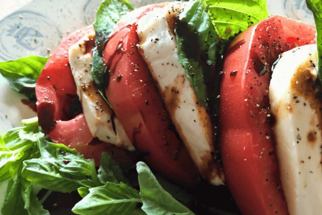Classic Caprese Salad with Rich Balsamic Glaze, close up on a plate