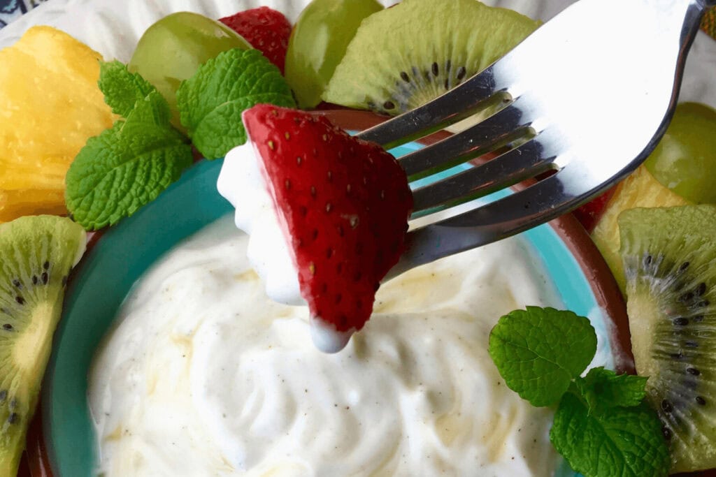 Strawberry dipped into the Honey Yogurt Dressing