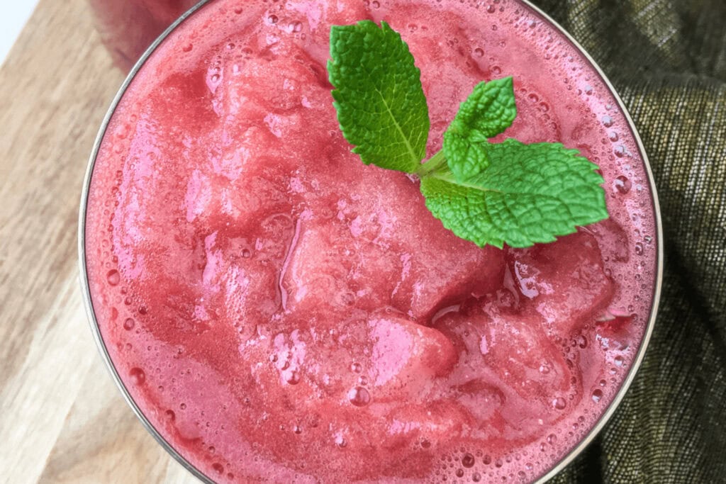 A closeup of a glass of Easy Homemade Frozen Watermelon Slush