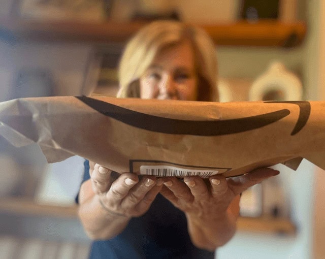 Lori holding an Amazon package - Amazon Shopping Secrets